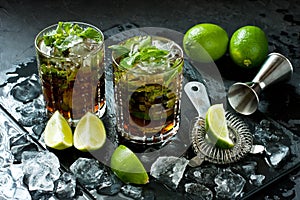 Cuba libre cocktail with rum, cola and lime, holidays party concept