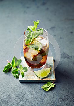 Cuba Libre in a Glass  rum with cola, lime, mint leaves and ice