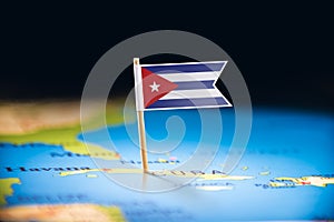 Cuba marked with a flag on the map