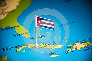 Cuba marked with a flag on the map