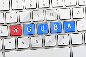 CUBA writing on white keyboard with a aircraft sketch