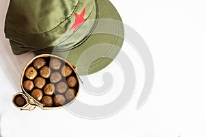 Cuban cigars rolled in banana leaf and military cap photo