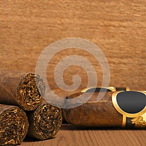 Cuban cigars on wooden background