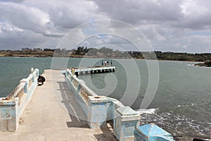 Cuban fishermen standing at the pier