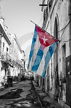 Cuban flag in a shabby street in Havana