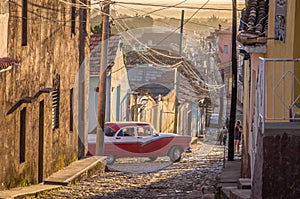 Cuban street with oldtimer in Trinidad