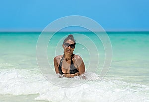 Cuban woman in the caribbean ocean in Cuba