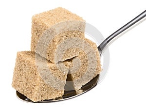 Cube of brown sugar on spoon