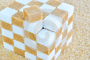 Cube of brown and white sugar cubes