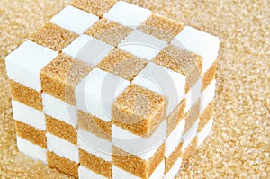 Cube of brown and white sugar cubes