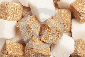 Cube of brown and white sugar texture background close up