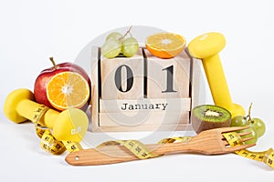 Cube calendar, fruits, dumbbells and centimeter, new years resolutions