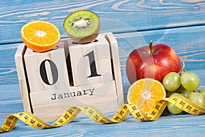 Cube calendar, fruits and tape measure, new years resolutions