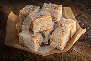 Cube cane sugar on wood desk