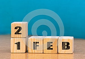 Cube shape calendar for February 21 on wooden surface with empty space for text,cube calendar for december on wood background