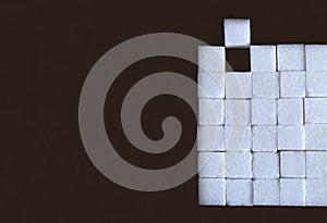 Cube sugar with brown background