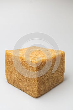 Cube synthetic rubber sample on a white background photo