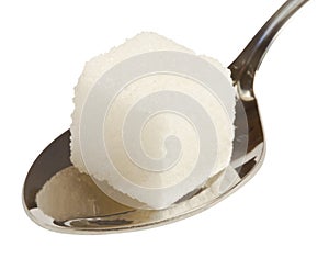 Cube of white sugar on spoon