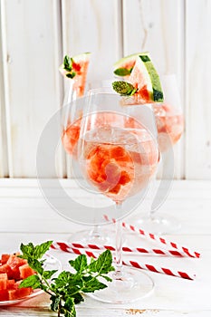 Cubed watermelon, fresh mint and straws