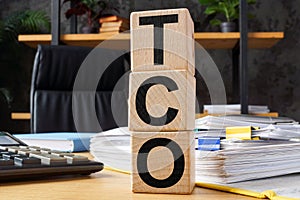 Cubes with abbreviation TCO Total Cost of Ownership. photo