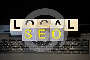Cubes with the acronym SEO for search engine optimization