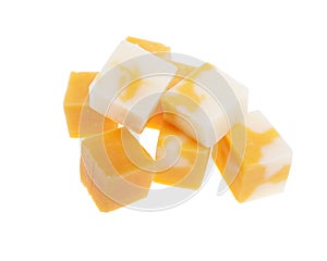 Cubes of cheddar cheese isolated on white