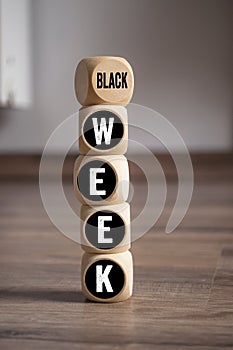 Cubes, dice or blocks with Black friday and black week on wooden background