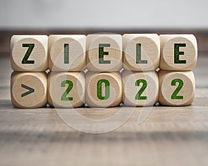 Cubes, dice or blocks with the german word for goals 2022 - Ziele 2022 on wooden background