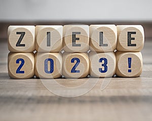 Cubes, dice or blocks with the german word for goals - ziele 2023 on wooden background