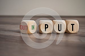 Cubes, dice or blocks with message input and output on wooden background