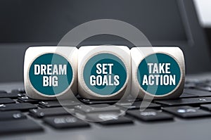 Cubes and dice with dream big, set goals and take action