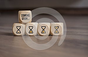 Cubes dice with hour glasses icon and coming soon