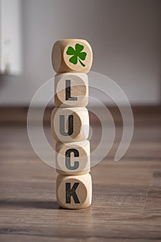 Cubes dice with Luck and shamrock or cloverleaf