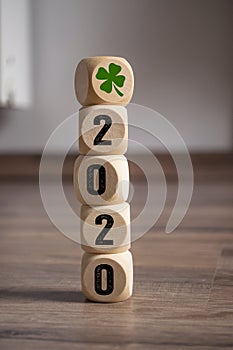 Cubes dice with Luck and shamrock or cloverleaf and 2020