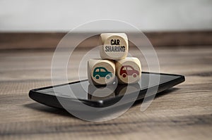 Cubes and dice with smartphone and car sharing app