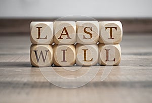 Cubes and dice with words last will on wooden background