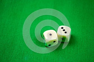 2 cubes dices on green background