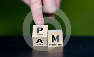 Cubes form the acronyms AM (Ante Meridiem) and PM (Post Meridiem).