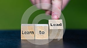 Cubes form the expression \'learn to lead\'. photo