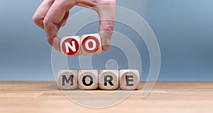 Cubes form the expression `no more`