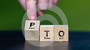 Cubes form the expression PTO (paid time off).