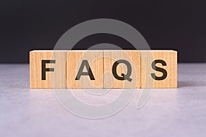 cubes form the word faqs. faqs word concept - finance, market and investment