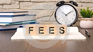 cubes form the word fees. scam word concept - finance, market and investment