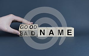 Cubes form the words Bad name or good name. Reputation concept in business