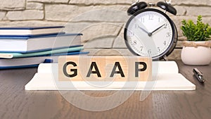cubes forming the word GAAP create a visual representation of Generally Accepted Accounting Principles. the arrangement
