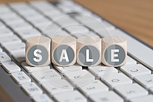 Cubes forming the word sale on a computer keyboard