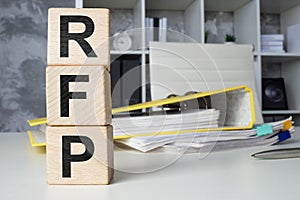 Cubes with letters RFP Request for Proposal in the office.