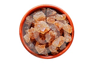 Cubes of organic palm tree rock sugar candy in a bowl isolated on a white background, Clipping path included