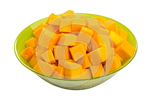 Cubes of raw pumpkin in bowl isolated on white background