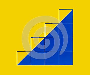 Cubes in stairs form. Professional development and growth, success and progress concept. Career ladder from yellow and